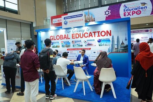 Gateway to Global Education booth busy with visitors across the hall