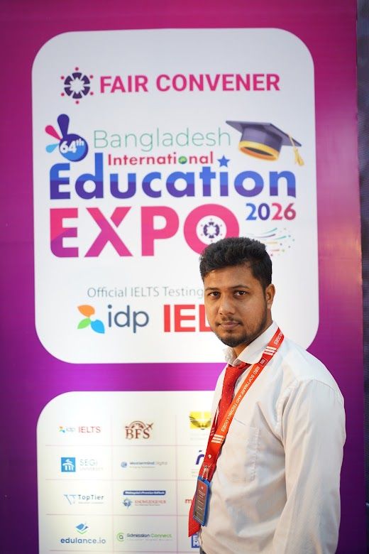 Official IELTS partner staff portrait at the Education Expo backdrop