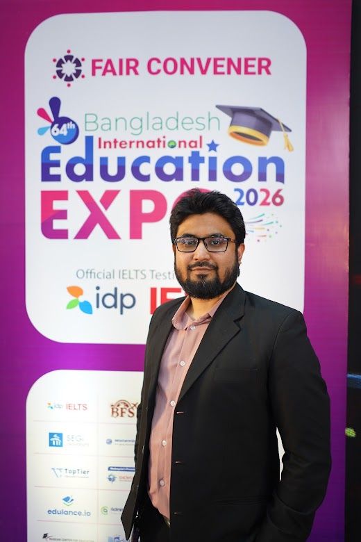 Exhibitor representative posed portrait at the IDP IELTS backdrop