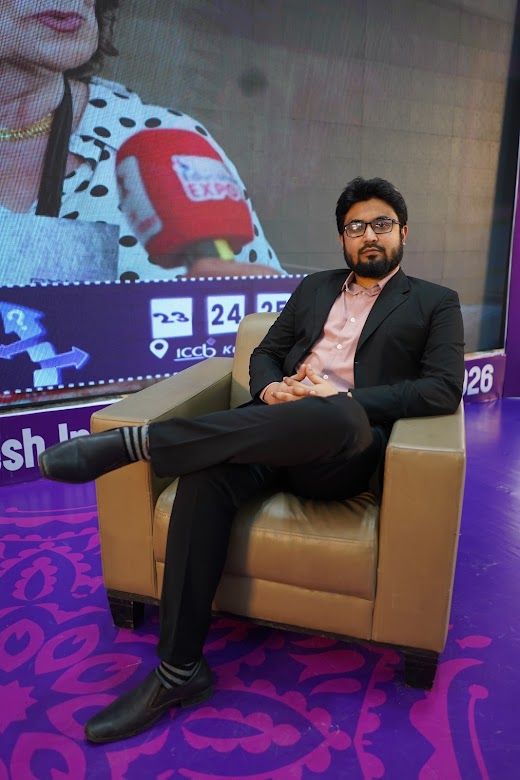 Guest seated for a sofa interview in front of the IELTS event screen