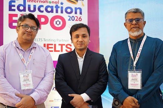 Group of three partners posed in front of the 64th BIEE Education Expo backdrop