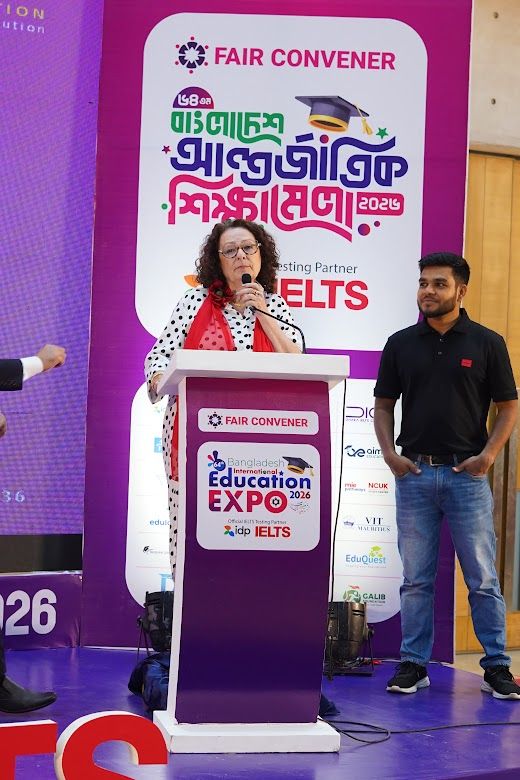 IELTS testing partner speaker addressing the audience from the podium